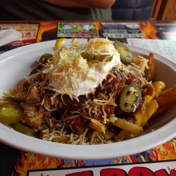 Fat Boys Barbque - Smoked chicken nachos: huge portion, tender, juicy and well-smoked chicken - Barbeque Near Me - Little Rock, Arkansas Fat Boys Barbque - Smoked chicken nachos: huge portion, tender, juicy and well-smoked chicken - Barbeque Near Me - Little Rock, Arkansas