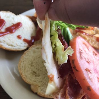 Mackinac Grille - Thin slice of turkey with cold cheese. The bacon taken from the cold fridge still has white grease on it no attempt to warm up. - Seafood Near Me - Saint Ignace, Michigan Mackinac Grille - Thin slice of turkey with cold cheese. The bacon taken from the cold fridge still has white grease on it no attempt to warm up. - Seafood Near Me - Saint Ignace, Michigan