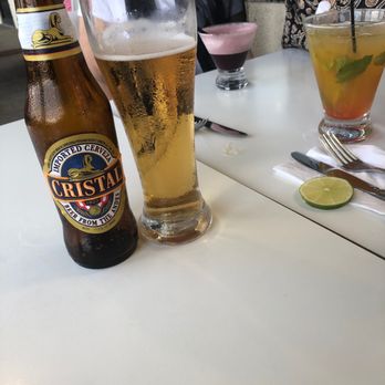 Aji Ceviche Bar - Left to right; Cristal Cerveza, Pisco Chicha Morada, Pisco Sour with Passion Fruit - Peruvian Near Me - Orlando, Florida Aji Ceviche Bar - Left to right; Cristal Cerveza, Pisco Chicha Morada, Pisco Sour with Passion Fruit - Peruvian Near Me - Orlando, Florida
