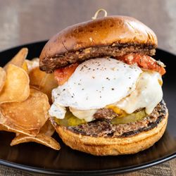 Common Grounds - CG Brunch Burger:  (8oz) **Award Winning** with pickles, tomato confit, cheddar or Swiss, egg any style, and CG's signature coffee bacon jam