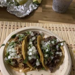 a plate of tacos and a cup of coffee a plate of tacos and a cup of coffee
