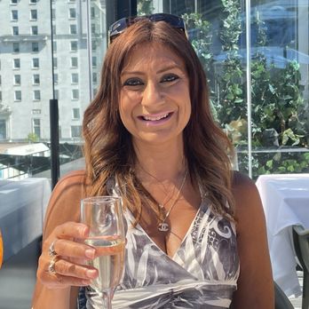 Black+Blue Vancouver - The birthday girl drinking a glass of Prosecco - Steakhouses Near Me - Vancouver, British Columbia Black+Blue Vancouver - The birthday girl drinking a glass of Prosecco - Steakhouses Near Me - Vancouver, British Columbia