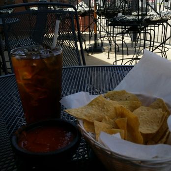 Senior Tequila - a basket of chips and a drink on a table - Mexican Near Me - Sherwood, Arkansas
