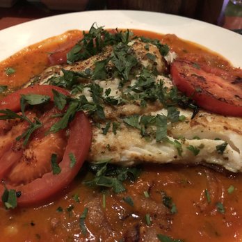 DishDash - Halibut on a bed of spinach and sautéed in a delicious tomato sauce... excellent dish! - Middle Eastern Near Me - Sunnyvale, California
