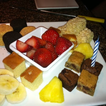 The Melting Pot - Dippers for Dark Chocolate Orange Dessert Fondue with Anniversary Candle - Fondue Near Me - Raleigh, North Carolina