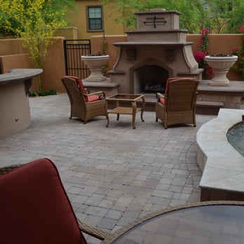 Lone Star Landscaping - Custom fireplace with firepots, barbecue with serving counter, water feature and travertine pavers. - Landscaping Near Me - Phoenix, Arizona