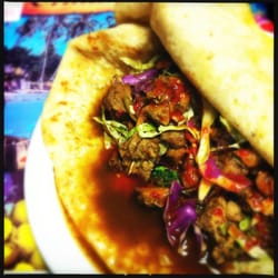 Harry Singh's Original Caribbean Restaurant - Jerk chicken roti with douses of Harry's fire sauce. The heat is amazing.