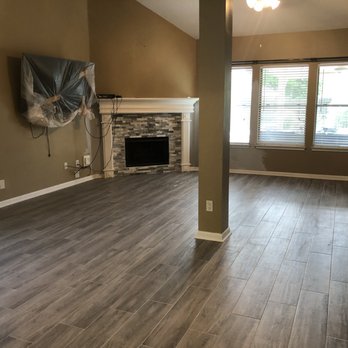 InGate Contracting - a living room with wood floors and a fireplace - General Contractors Near Me - Houston, Texas InGate Contracting - a living room with wood floors and a fireplace - General Contractors Near Me - Houston, Texas