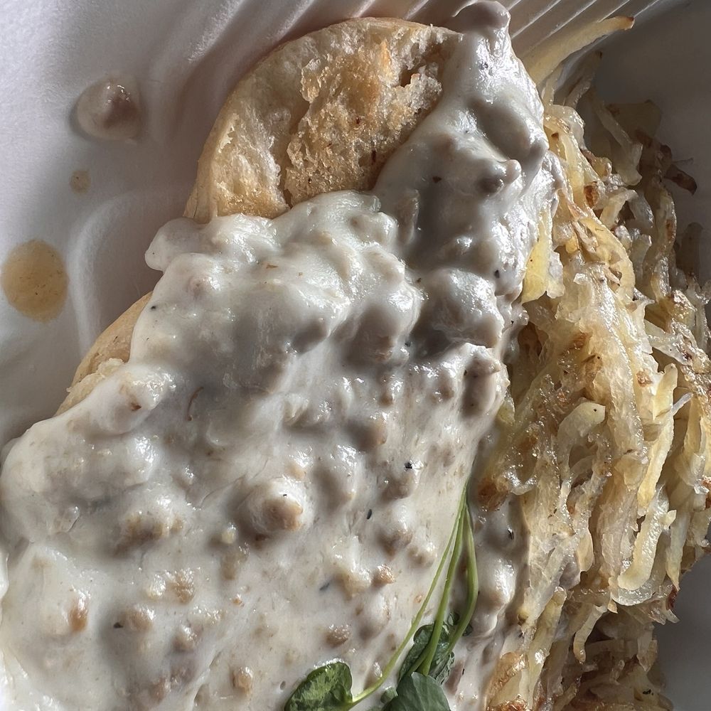 The Kitchen Witch Cafe & Bakery - Biscuits and gravy $16 with a side of hashbrowns. $5 - Bakeries Near Me - Pāhoa, Hawaii