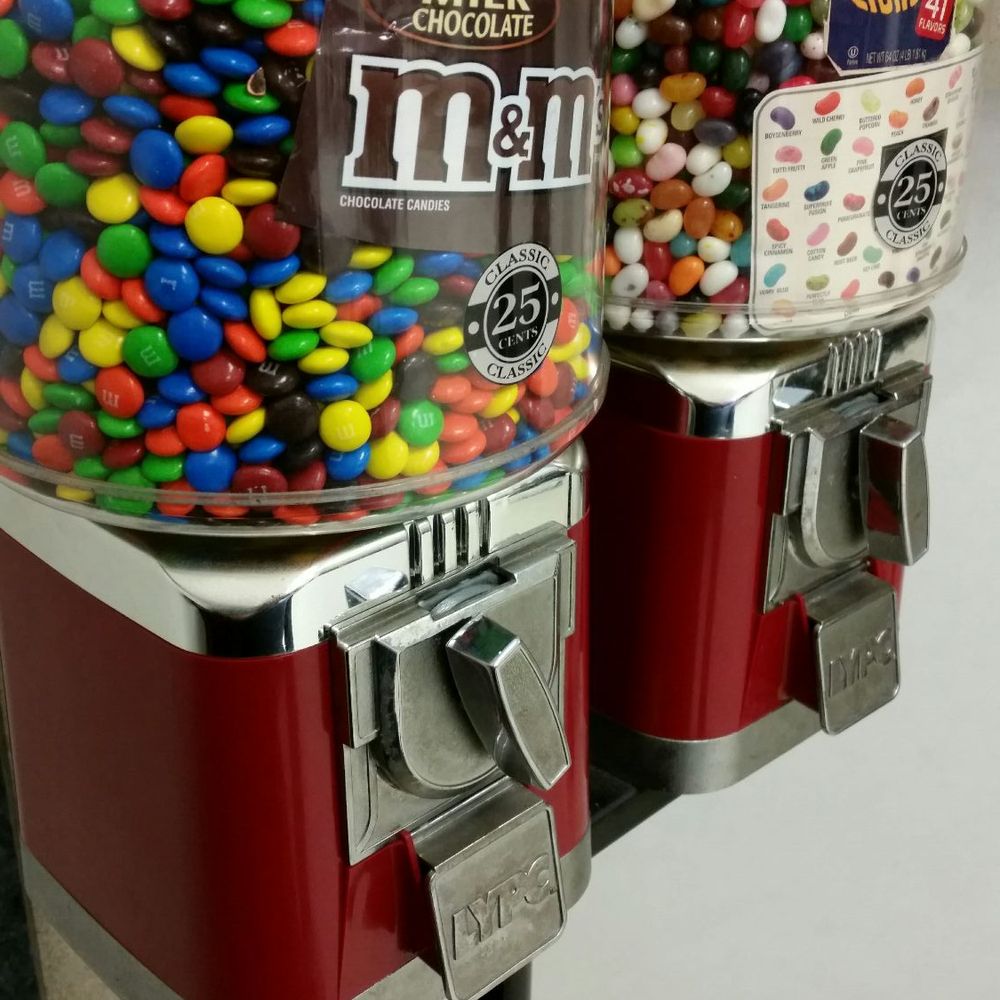 a pair of candy dispensers a pair of candy dispensers