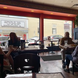 people sitting at tables eating