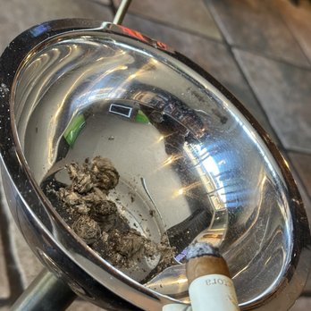 Javelina Cigar - a cigarette in a silver ashtray - Cigar Bars Near Me - Scottsdale, Arizona Javelina Cigar - a cigarette in a silver ashtray - Cigar Bars Near Me - Scottsdale, Arizona