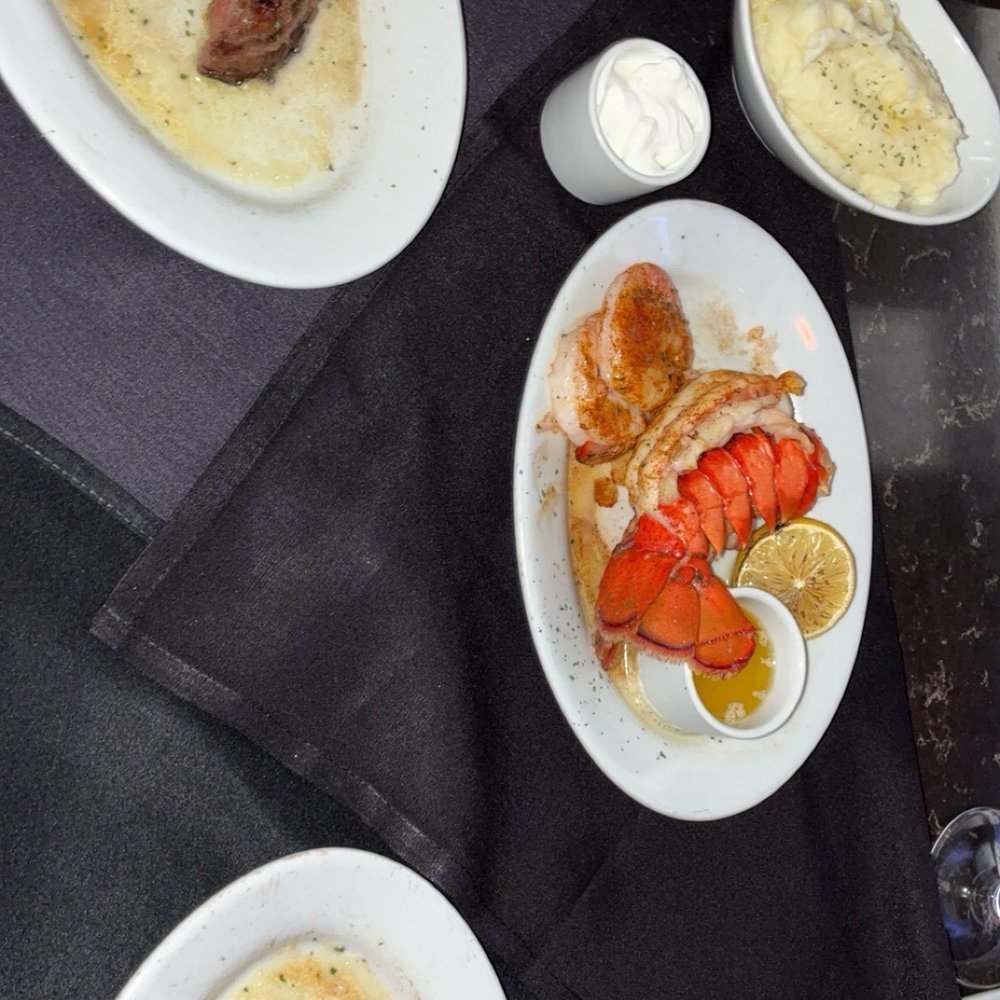 Ruth's Chris Steak House - Filet with shrimp and lobster spilt on two plates. - Steakhouses Near Me - Minneapolis, Minnesota Ruth's Chris Steak House - Filet with shrimp and lobster spilt on two plates. - Steakhouses Near Me - Minneapolis, Minnesota