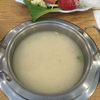 Centre Street Japanese Hotpot - Pork broth. Tip: add the satay sauce to the broth elevates it to another level - Hot Pot Near Me - Calgary, Alberta