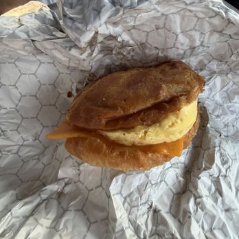 The Daily Grind - Bacon egg and cheese on a croissant - Coffee & Tea Near Me - Surf City, North Carolina