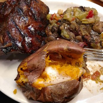 Texas Roadhouse - Steak Rib dinner with a sweet potato. I added Green Chile with mushrooms. - Steakhouses Near Me - Albuquerque, New Mexico Texas Roadhouse - Steak Rib dinner with a sweet potato. I added Green Chile with mushrooms. - Steakhouses Near Me - Albuquerque, New Mexico