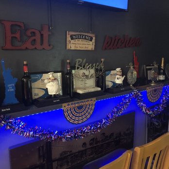 Izzy's NY Pizza - a bar with blue lights - Pizza Near Me - Lilburn, Georgia