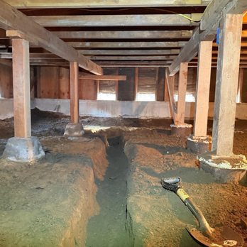 Attics Express - Digging in the crawl space for sump pump - Insulation Installation Near Me Attics Express - Digging in the crawl space for sump pump - Insulation Installation Near Me