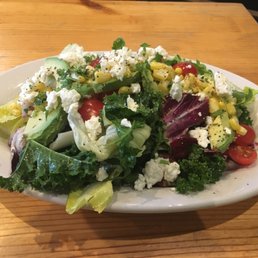 a salad on a white plate a salad on a white plate