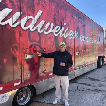 Budweiser Brewery Experience - Our tour guid petting the a Clydesdale. He is telling us about the Clydesdale travel trailer. - Beer Tours Near Me - Saint Louis, Missouri Budweiser Brewery Experience - Our tour guid petting the a Clydesdale. He is telling us about the Clydesdale travel trailer. - Beer Tours Near Me - Saint Louis, Missouri