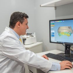 Fillmore Dental Group - Dr. Mauricio Fonrodona, ABOI Diplomate, working on a patient's impression.
