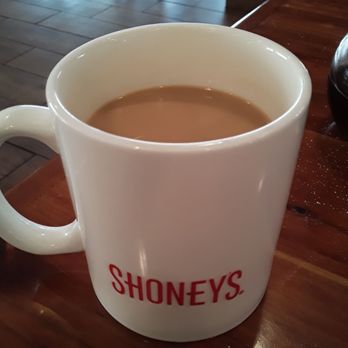 Shoney's - a cup of coffee on a table - New American Near Me - Uniontown, Pennsylvania