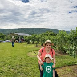 Frog Eye Farm - Beautiful mountains surrounding rows of of about 20 varieties of ripe blueberries.