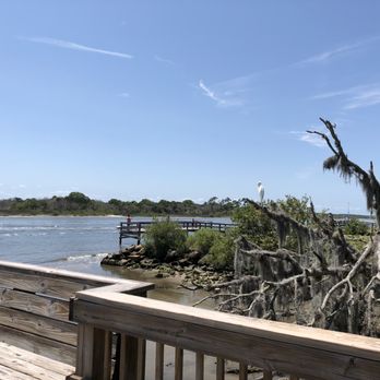 Captains BBQ - a wooden deck overlooking a body of water - Barbeque Near Me - Palm Coast, Florida