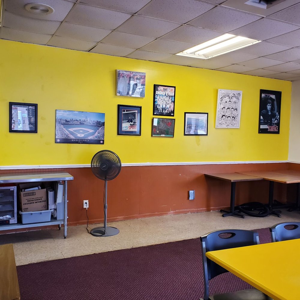 Hungry Boys - a yellow room with pictures on the wall - Chicken Wings Near Me - Pontiac, Illinois Hungry Boys - a yellow room with pictures on the wall - Chicken Wings Near Me - Pontiac, Illinois