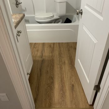 Epic Home Renovations - a bathroom with a toilet and bathtub - Decks & Railing Near Me Epic Home Renovations - a bathroom with a toilet and bathtub - Decks & Railing Near Me