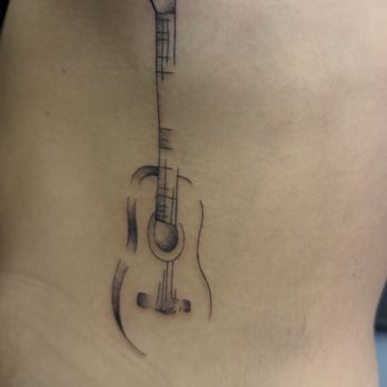 Pride and Glory - Guitar on side and partial ribs - Tattoo Near Me - Nashville, Tennessee Pride and Glory - Guitar on side and partial ribs - Tattoo Near Me - Nashville, Tennessee
