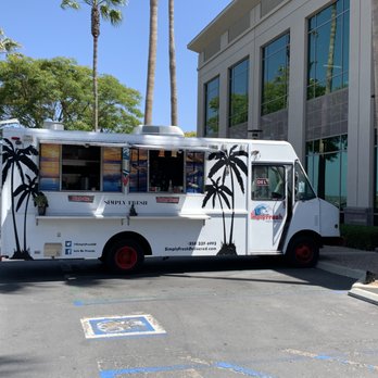 Simply Fresh - a food truck parked in front of a building - Sandwiches Near Me Simply Fresh - a food truck parked in front of a building - Sandwiches Near Me
