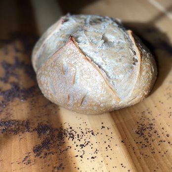 Breaking Bread 803 - a loaf of bread on a cutting board - Bakeries Near Me - Columbia, South Carolina Breaking Bread 803 - a loaf of bread on a cutting board - Bakeries Near Me - Columbia, South Carolina