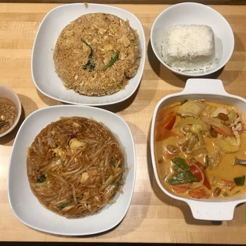 Royal Thai Cuisine - Clockwise: basil fried rice, white rice, masaman curry, spicy pad thai and side of peanut sauce. - Thai Near Me - Eastham, Massachusetts Royal Thai Cuisine - Clockwise: basil fried rice, white rice, masaman curry, spicy pad thai and side of peanut sauce. - Thai Near Me - Eastham, Massachusetts