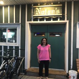 a woman standing in front of the door
