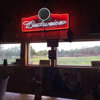 Keith's Place - a view of a baseball field through a window - Bars Near Me - Florence, Texas