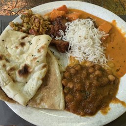 Different curries with rice, 70. Garlic Naan, and salad. 152. Chana Masala was excellent. Different curries with rice, 70. Garlic Naan, and salad. 152. Chana Masala was excellent.