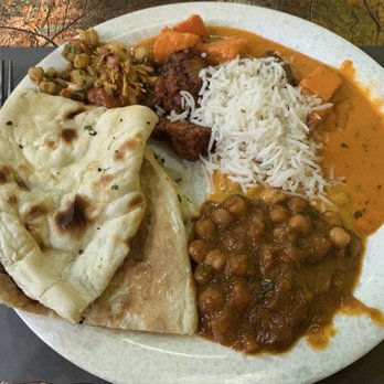 Pooja Indian Cuisine - Different curries with rice, 70. Garlic Naan, and salad. 152. Chana Masala was excellent. - Indian Near Me - Somerset, New Jersey Pooja Indian Cuisine - Different curries with rice, 70. Garlic Naan, and salad. 152. Chana Masala was excellent. - Indian Near Me - Somerset, New Jersey