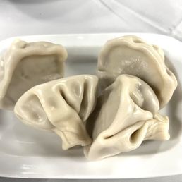 Georgian soup dumplings. 4 to an order. Meat and juice filled. Georgian soup dumplings. 4 to an order. Meat and juice filled.