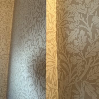Professional Wallpapering Design - Folded paper on top of other paper in the corner like a bad Xmas present. - Wallpapering Near Me