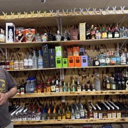 Tipsy Fox Liquor - Name brand liquors behind the counter