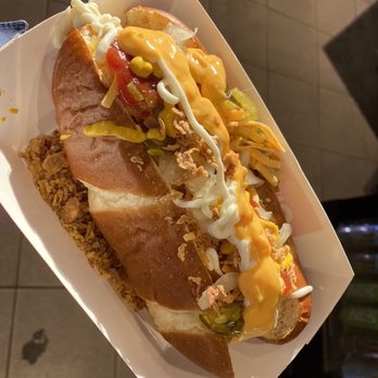 Circle K - a hand holding a hot dog with toppings - Convenience Stores Near Me - Calgary, Alberta Circle K - a hand holding a hot dog with toppings - Convenience Stores Near Me - Calgary, Alberta