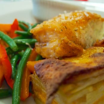 Classic on Noble - Parmesan-crusted baked salmon with sauteed fresh veggies and crispy potato gratin, at Classic on Noble - Southern Near Me - Anniston, Alabama Classic on Noble - Parmesan-crusted baked salmon with sauteed fresh veggies and crispy potato gratin, at Classic on Noble - Southern Near Me - Anniston, Alabama