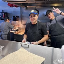 Employees working they cook and keep the place very clean