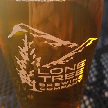Lone Tree Brewing - Peach Pale Ale on the patio is my favorite (minus a few sips.... tasty!) - Breweries Near Me - Lone Tree, Colorado