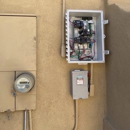 an electrical panel and a water meter an electrical panel and a water meter