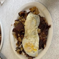 Village Diner - Burnt food. Waited an hour for this. 06-15-3025 Corned Beef Hash & 2 Eggs. Eggs not burnt but everything else underneath was.