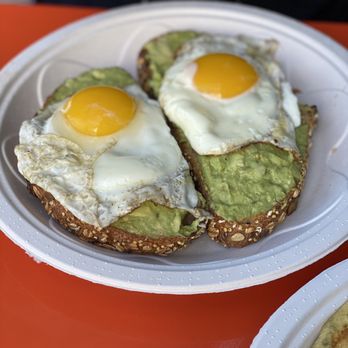 Tasty Beach Cafe - Eggtravaganza Avocado Smash Toast Breakfast, eggs cooked over medium you can't get them however - Cafes Near Me - Miami Beach, Florida Tasty Beach Cafe - Eggtravaganza Avocado Smash Toast Breakfast, eggs cooked over medium you can't get them however - Cafes Near Me - Miami Beach, Florida