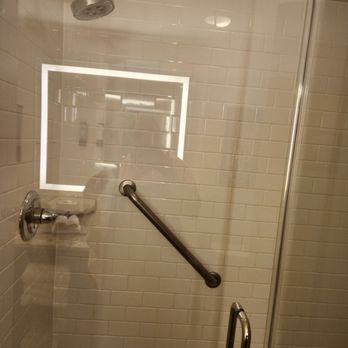 The Mercantile Hotel New Orleans, LA - Walk in shower, grab bar , back of shower has dispensers for shower gel, shampoo and conditioner. - Hotels Near Me - New Orleans, Louisiana The Mercantile Hotel New Orleans, LA - Walk in shower, grab bar , back of shower has dispensers for shower gel, shampoo and conditioner. - Hotels Near Me - New Orleans, Louisiana
