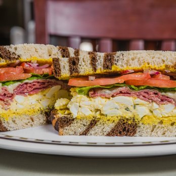 Heidi's Brooklyn Deli - Bronx Bomber sandwich served on marble rye bread with egg salad, pastrami, Swiss cheese, spicy mustard, lettuce, tomato and onion - Delis Near Me - Auburn, Maine Heidi's Brooklyn Deli - Bronx Bomber sandwich served on marble rye bread with egg salad, pastrami, Swiss cheese, spicy mustard, lettuce, tomato and onion - Delis Near Me - Auburn, Maine